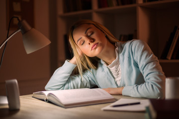 Tired student learning at home