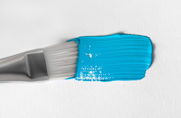 Blue color oil paint stroke on white background.
