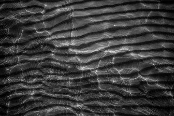 Small vawes of baltic sea. Patterns of water and light. 