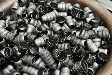 Production metal parts, randomly lying parts for the background
