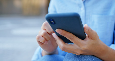 Woman use of cellphone at street