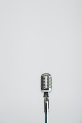 Fototapeta premium vintage microphone isolated on grey with copy space
