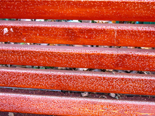 texture of brown and red wooden planks with a touch of frost