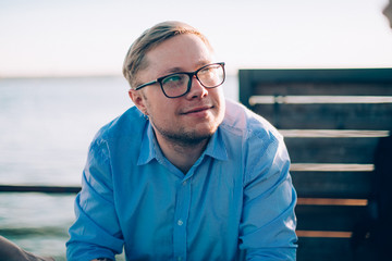 Portrait of a young man in glasses.