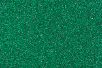 Saturated green glitter texture, stylish Christmas wallpaper for your desktop.