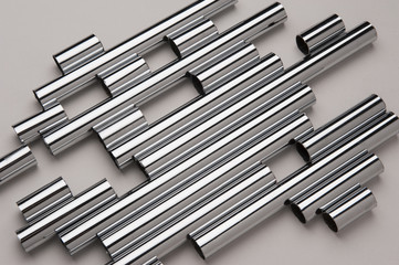 Chrome silver pipes on the gray background
