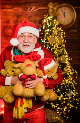 In Shopping Mall. man love bear toy. merry christmas. happy new 2020 year. xmas gifts and presents. winter season. holiday shopping online. cheerful santa man hold toys. teddy bear for everyone