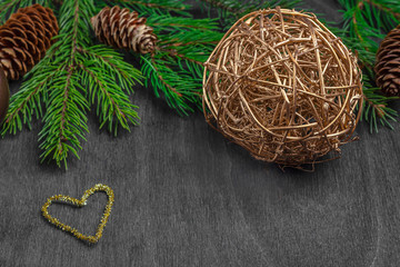 Christmas composition for postcard, cover, banner. Fir branches and balls, cone on rustic wooden background. Christmas, winter holidays, new year concept. Close up, copy space for text.