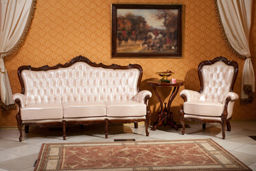 empty interior living room background in warm colors decorated with classic furniture sofa and...