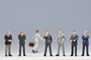 mini business men standing