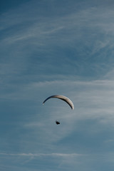 View of a paragliding in the sky. Paraglider flying over in The Nature Park Zumberak, Croatia 