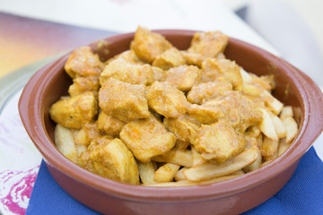 Chicken curry on French fries