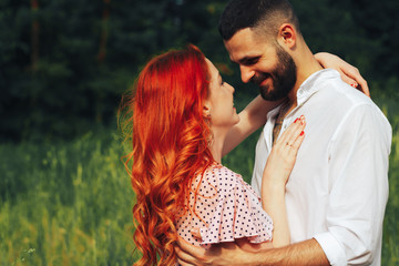 Fototapeta premium happy, couple in love cuddling, ginger girl. minute to kiss. date