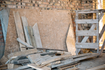 Lumber a construction material on construction site background.
