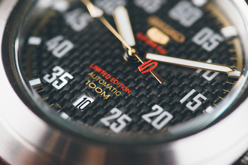 Close up of black watch dial. Top view. Commercial concept.
