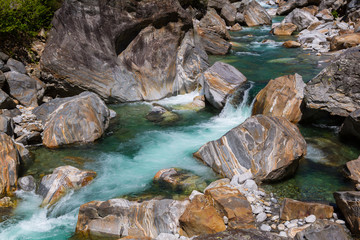colorful stones and water of Verzasca river in Ticino Switzerland