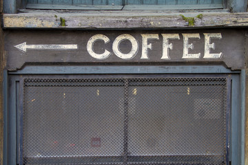 Old coffee sign on wall