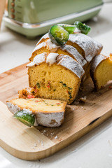Fig Cake with Jelly Fruits and Powdered Sugar on Wooden Board.