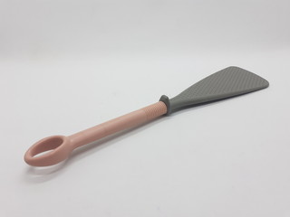 Beautiful Cooking Spoon from Plastic and Rubber for Kitchenware Utensils in White Isolated Background