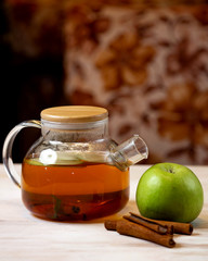 tea pot with apple slices and cinnamon