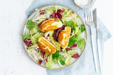 Cyprus fried halloumi with healthy salad. Lchf, pegan, fodmap, paleo, scd, keto, ketogenic diet. Balanced food, clean eating recipe. Top view, white background