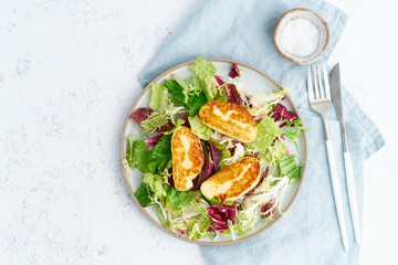 Cyprus fried halloumi with healthy salad. Lchf, pegan, fodmap, paleo, scd, keto, ketogenic diet. Balanced food, clean eating recipe. Top view, copy space