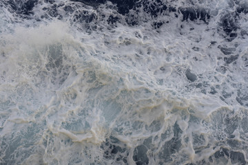 Abstract blue sea water with white foam for background, nature background concept