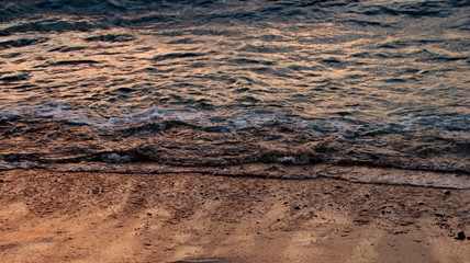 Someone when walking on the beach with feet barefoot