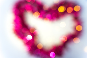 Fototapeta premium sparkling bokeh in the shape of a heart. festive background