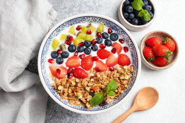 Healthy breakfast bowl of granola with fruits and berries. Top view. Clean eating, dieting concept