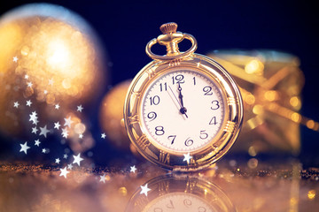 New Year's at midnight - Old clock with holiday lights