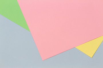 Pastel color paper in geometric shapes as background