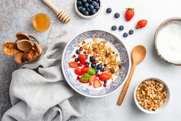 Healthy breakfast bowl granola fruits and berries. Vegetarian meal, concept of dieting, weight loss, healthy lifestyle and eating - obrazy, fototapety, plakaty