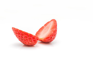 One cut strawberry placed on white background.