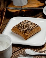 gray bread covered with peeled seeds and poppy seeds