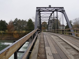 Wide shot of the War Eagle Bridge, an old bridge listed in the National Register of Historical Places in Arkansas.