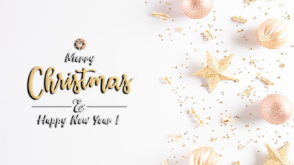 Christmas background concept. Top view of Christmas decoration, light golden and orange pastel  ball, star with snowflakes on white background.