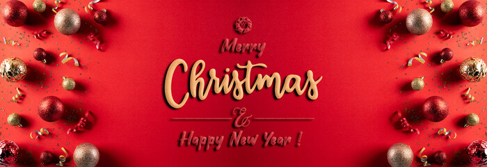 Christmas background concept. Top view of Christmas red and golden ball with snowflakes on light red pastel background.