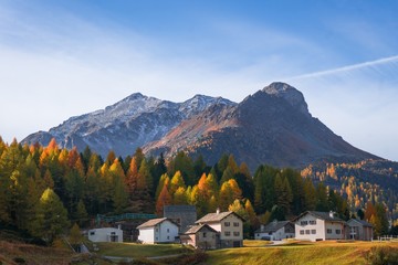 Fototapeta na wymiar The village of Maloja, in the woods on the shores of Lake Sils, in the canton of Graubünden, Switzerland - October 2019.