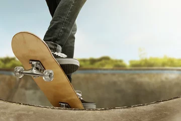 Poster Skateboarder skateboarding at skate park © fotokitas