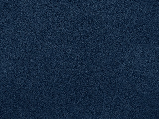 Blue abstract background. Dark blue stone texture. Beautiful vintage background. Toned texture of marble chips on the facade of the building.