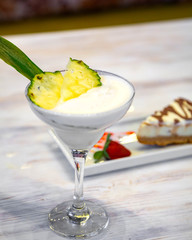 pinacolada cocktail with ananas slices