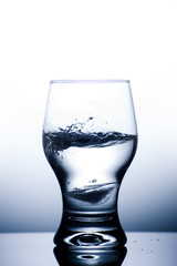 Glass with water isolated on a white background