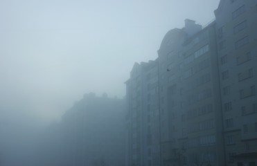 Thick morning fog on the city streets