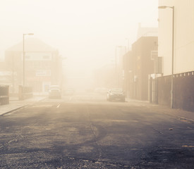 A fog covered city side street