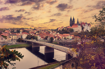 Fototapeta premium Incredible Colorful sunset. View of Albrechtsburg Castle, Saxony, Germany. Wonderful Stunning Landscape with Picturesque sky reflected in Elbe river early in the morning. Scenic views Germany