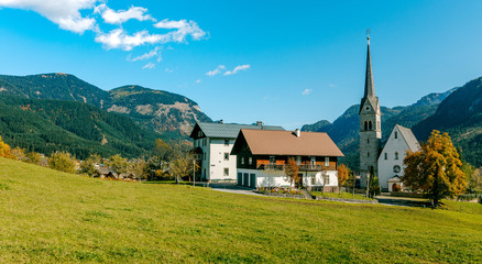 Fototapeta na wymiar Wonderful Alpine Landscape. Christianity churh in Gosau village at sunny day. Alps, Austria, Europe