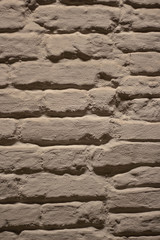 old brick wall covered with white putty