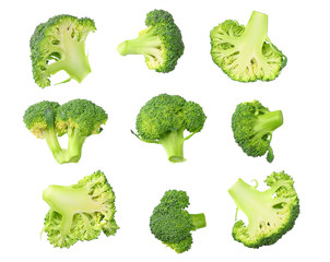 green broccoli with slices and leaves isolated on white background. top view