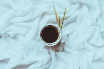 Morning coffee on the bed, Black coffee placed on a white cloth.